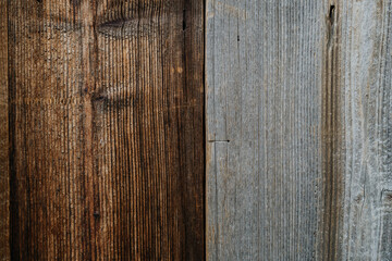 Close-up texture of old gray and brown wood grain.
