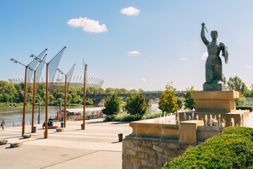 Warsaw Mermaid statue, symbol of the city. View of the Vistula river and Swietokrzyski bridge