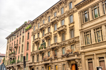 Milan, Italy - July 12, 2022: Residential building facades on the streets of Milan
