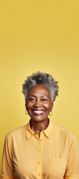 Happy Laughing African American 50 Years Old Woman. Happy Woman On A Yellow Background. The Concept Of Health Care, Mental Health. Copy Space