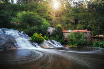 A Barosa waterfall and watermills in Barro, Galicia, Spain
