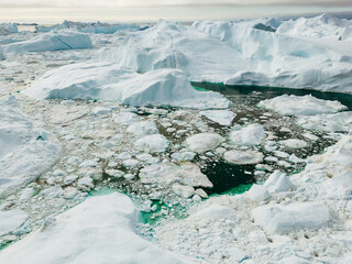 Greenland Ilulissat Icefjord Aerial View. Iceberg and glacier ice in Arctic nature landscape in...