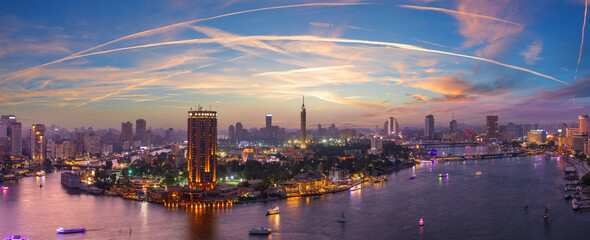 Fototapeta na wymiar Wonderful purple sunset panorama of the Nile and Gezira island in Cairo, Egypt