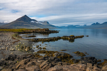 Stunning coastal scenery with volcanic rock in the foreground, Djúpivogur, Berufjörður,  Austurland, East Fjords, Eastern Iceland