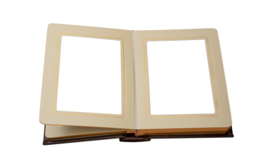 Open photo album in brown cover with gold border lines on pages, top view