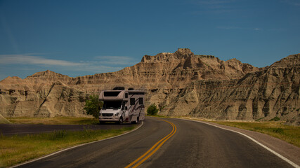 Rv motorhome pulling off road for viewing of the South Dakota badlands