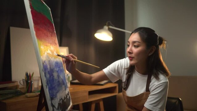 
Woman Artist painting with paint brush on canvas work art and mix oil painting on palette at home studio. Artist woman works and Creative on
Abstract Oil Painting at night. Hobby and leisure concept.