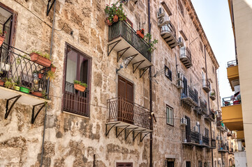 Fototapeta na wymiar Palermo, Italy - July 18, 2022: Classic architecture and building facades on the streets in Palermo 