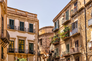 Fototapeta na wymiar Palermo, Italy - July 18, 2022: Classic architecture and building facades on the streets in Palermo 