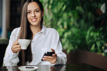 Portrait of a young woman in a coffee shop