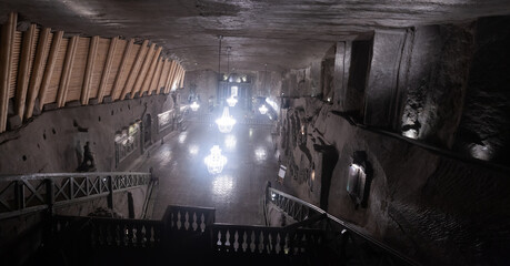 Illuminated underground active Chapel of Saint Kinga in medieval salt mine in Wieliczka, Poland