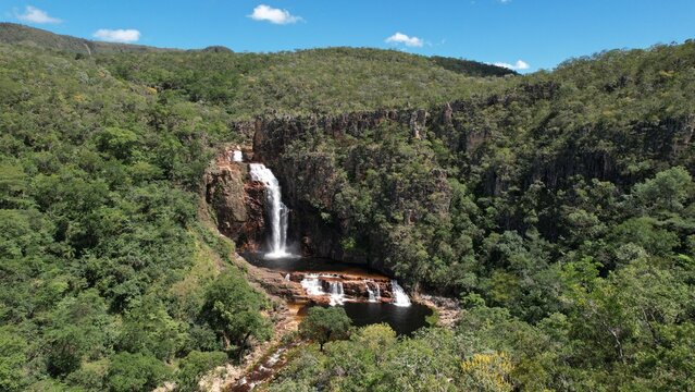 
aerial view of the Catedral waterfall and Macaco river in Complexo do Macaco in Chapada dos Veadeiros Goi&aacute;s Brazil sunny day, waterfall, rocks and vegetation of the cerrado
