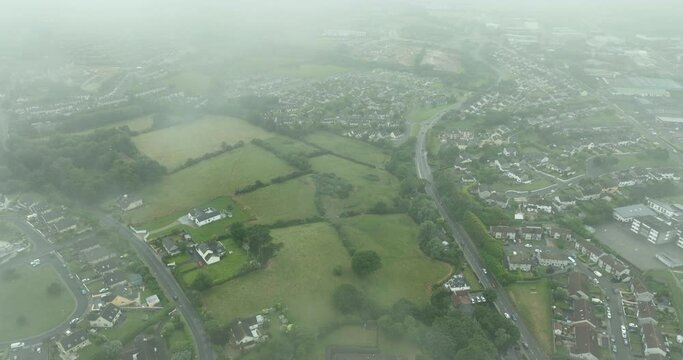 Panoramic bird's eye view of the misty town of Wexford, Ireland 4k