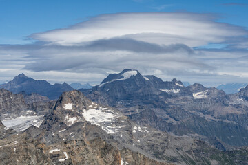 view of Gran Paradiso mountain and glacier from Ciamarella peak. cloudy sky, mountains landscape. italian Alps