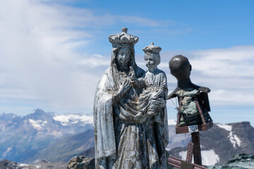 Obraz premium Madonna della Ciamarella statue and saint Leonardo Murialdo bust on top of Ciamarella mountain peak. Italian Alps