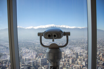 Lunettes and view of the Andes mountain range through the largest building in South America Sky Costanera located in Santiago, Chile