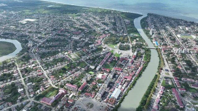Scenic view from drone of Georgian port city of Poti located at entrance of Rioni river into Black Sea on sunny Autumn day, Samegrelo-Zemo Svaneti region.