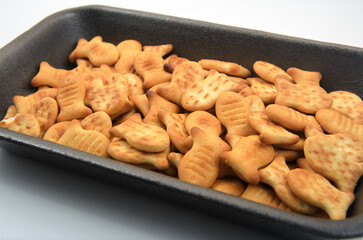 cracker cookies on plate isolated on white