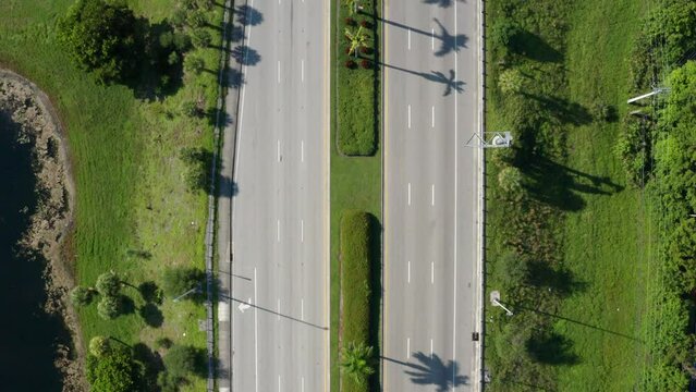 Drone shot of South Florida with lakes and palm trees, clouds with blue skies