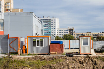 Change houses on construction site. Metal containers for staff of architectural company. Change...