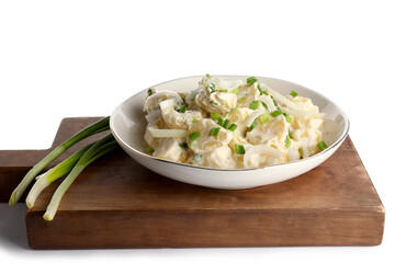Plate of tasty Potato Salad with greens on white background