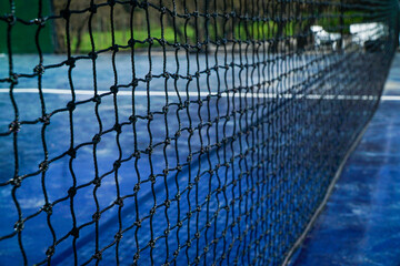 Close up view of a paddle tennis net.