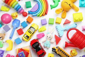 Different children's toys on white background, flat lay