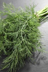Bunch of fresh dill on grey table, closeup