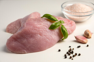 Raw turkey fillet on white background. Fresh uncooked turkey breast meat.