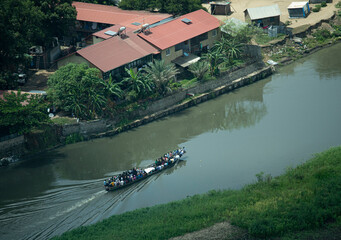 Aerial view of a boat packed with migrants going down the Nile River in Juba, South Sudan