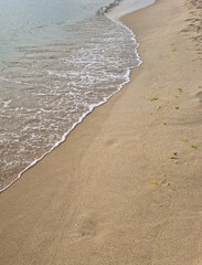 Soft beautiful ocean wave on sandy beach. Background