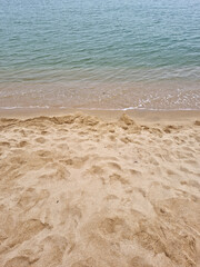 Soft beautiful ocean wave on sandy beach. Background