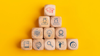 Graduation hat symbols in wooden cubes stacked, Internet education course degree, E-learning...