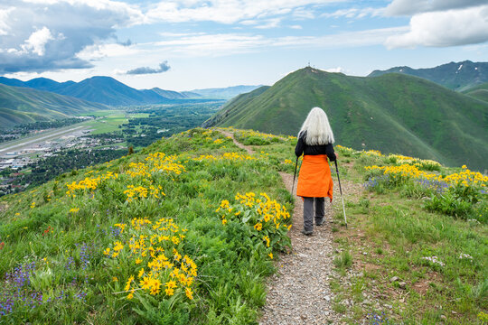 USA, Idaho, Hailey, Senior blonde woman hiking on Carbonate Mountain trail
