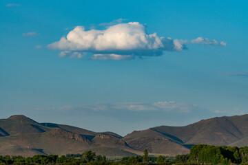 USA, Idaho, Bellevue, Cloud floating over foothills on sunny day