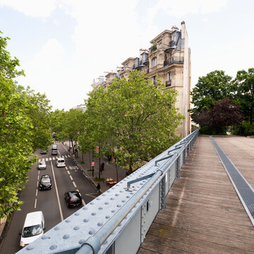 France, Paris, Pedestrian bridge above city street and traffic&nbsp;