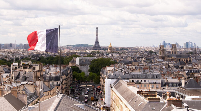 France, Paris, Cityscape with french flag and Eiffel tower in background&nbsp;