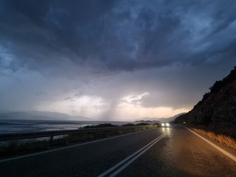 rain tornado on the road  in the evening storm bad weather travelling