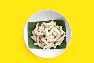 Fresh lotus rootlet on yellow background.