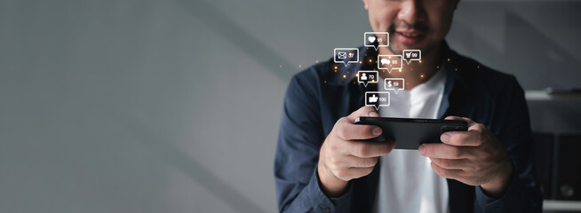People using social media and digital online marketing concepts on mobile phones with icons such as notifications, messages, comments on the smartphone screen.