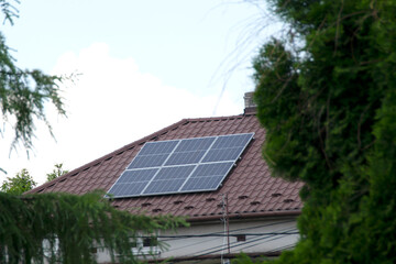Fototapeta premium Installing a Solar Cell on a Roof.