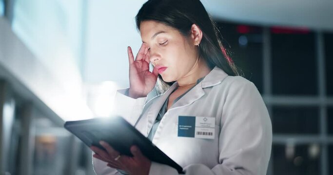 Hospital doctor, digital and tablet with headache, test results fail or mistake in healthcare research crisis at night. Woman, stress or medical professional working late on technology with burnout