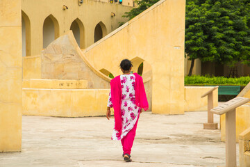 Woman tourist at the Jantar Mantar observatory, Jaipur, UNESCO World Heritage Site, India.