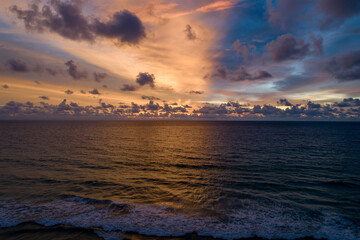 Fototapeta premium Aerial view sunset sky over sea,Nature Light Sunset or sunrise over ocean,Colorful dramatic scenery sky, Amazing clouds and waves in sunset sky beautiful light nature background