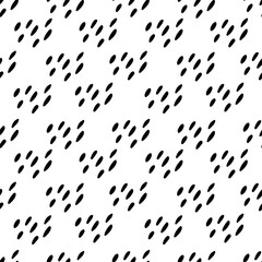 Seamless pattern of hand-drawn black dots. Abstract seamless texture of spots in doodle style.