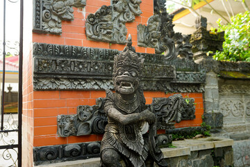 Fototapeta na wymiar indian monkey, statue of hindu god hanoman on a temple background
