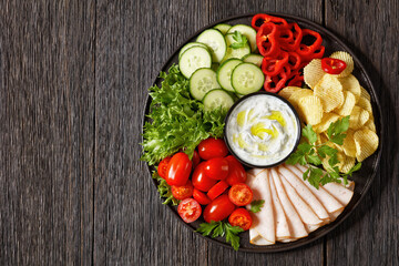 ham, chips, leafy greens, veggies snack platter