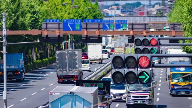 A timelapse of traffic jam at the downtown street in Tokyo telephoto shot panning