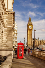 big ben and city tower with red telephone box in Westminster London England.