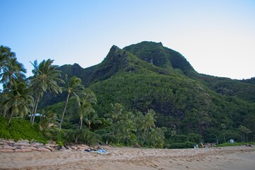 Taking a sunset dip at Tunnels and Ha'ena Beaches, located at the end of Kuhio Highway in Kauai,...